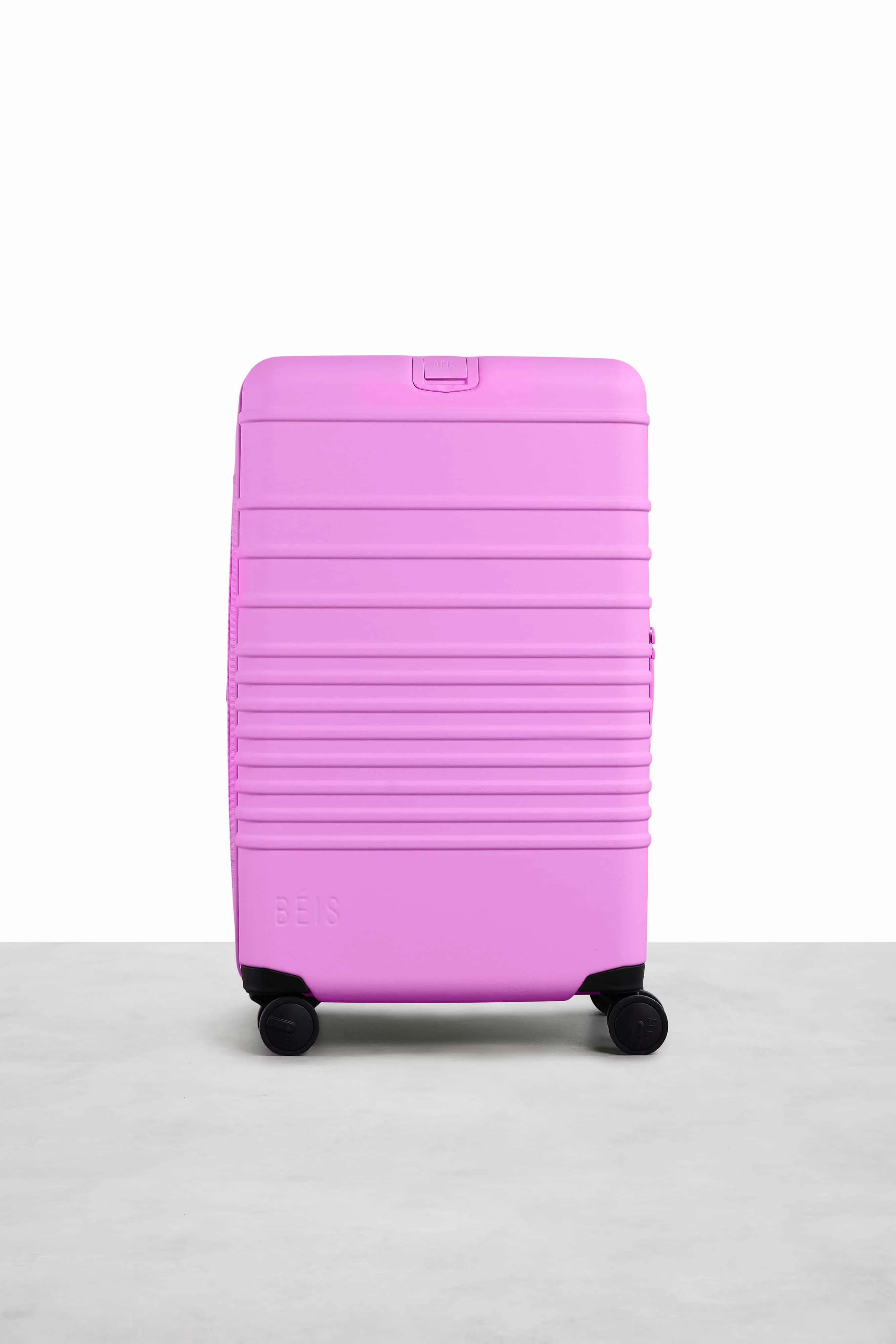 The Medium Check-In Roller in Berry